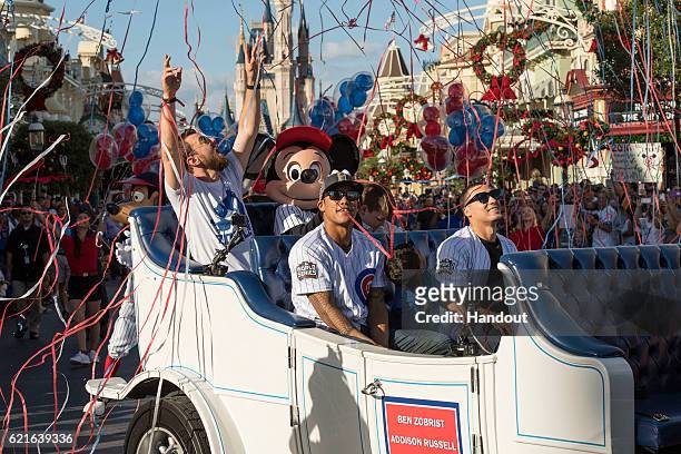 In this handout photo provided by Disney Parks, world champions MVP Ben Zobrist, Addison Russell and Javier Baez, of the Chicago Cubs are joined by...
