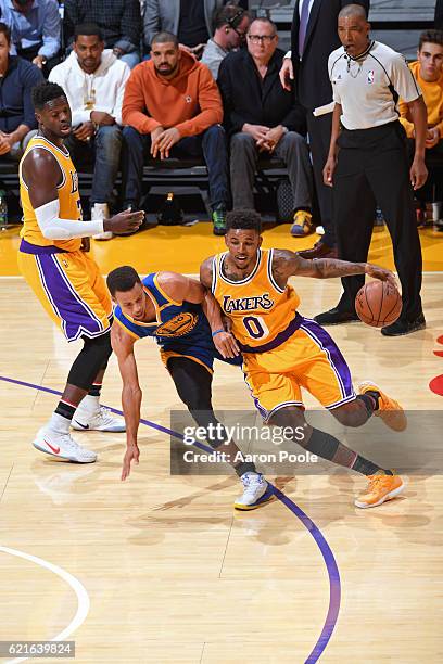 Nick Young of the Los Angeles Lakers dribbles the ball around Stephen Curry of the Golden State Warriors on November 4, 2016 at STAPLES Center in Los...