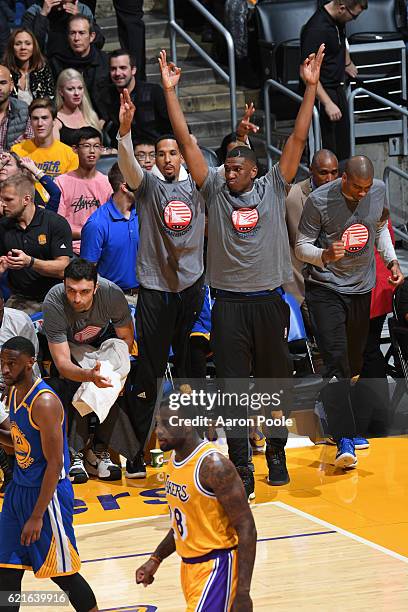 Kevon Looney of the Golden State Warriors celebrates a three point basket from the bench during the game against the Los Angeles Lakers on November...