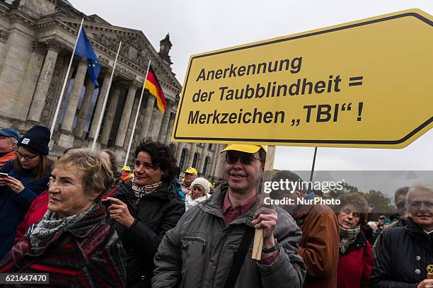 Protesters against the planned Federal Law of Participation hold the banners in Berlin, Germany, on 7 November 2016. People with disabilities fear...