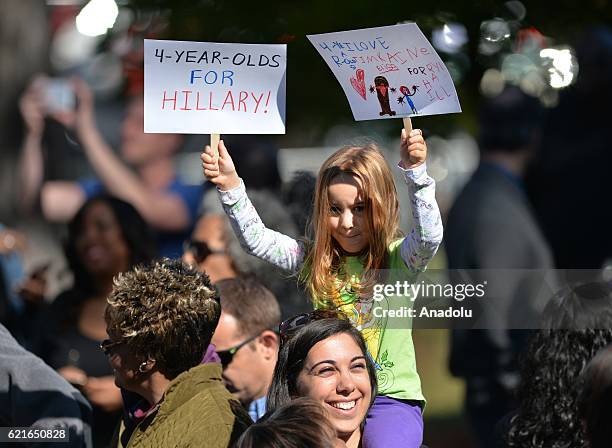 Girl holds banners as Democratic vice presidential candidate Tim Kaine attends a campaign event in support of Democratic presidential candidate...