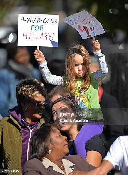 Girl holds banners as Democratic vice presidential candidate Tim Kaine attends a campaign event in support of Democratic presidential candidate...