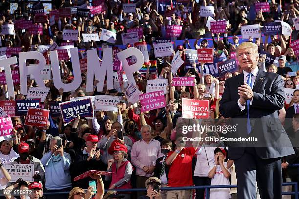 Republican presidential nominee Donald Trump takes the stage during a campaign rally at the J.S. Dorton Arena November 7, 2016 in Raleigh, North...