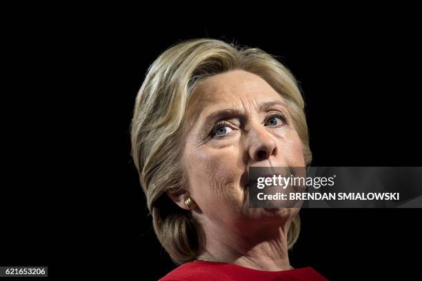 Democratic presidential nominee Hillary Clinton pauses while speaking during a rally at the Grand Valley State University Fieldhouse November 7, 2016...