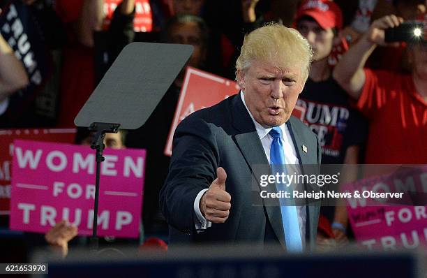 Republican Presidential candidate Donald Trump gives a thumbs up to the crowd as he finishes his speech at Dorton Arena Monday, Nov. 7, 2016 in...