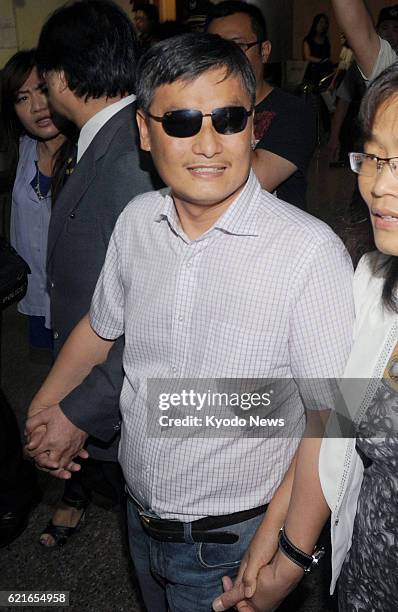 Taiwan - Exiled Chinese human rights activist Chen Guangcheng is pictured after arriving at an airport near Taipei, Taiwan, on June 23, 2013.