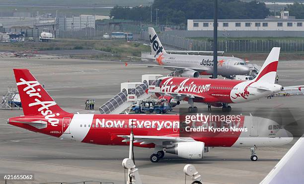 Japan - File photo shows airplanes of AirAsia Bhd., Asia's biggest budget airline based in Malaysia, at Narita airport near Tokyo in July 2012....