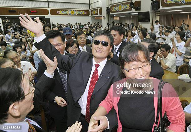 Taiwan - Chinese human rights advocate Chen Guangcheng arrives at Taiwan's legislature in Taipei on June 25, 2013. Chen has been living in the United...