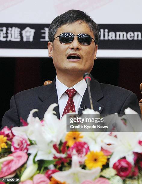 Taiwan - Chinese human rights advocate Chen Guangcheng gives a speech at Taiwan's legislature in Taipei on June 25, 2013. Chen has been living in the...