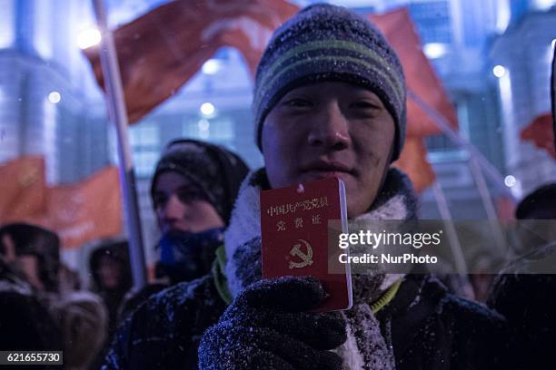 Chinese communist party member attend a communist rally in central St.Petersburg, Russia, 07 November 2013, during their rally to mark the 99th...