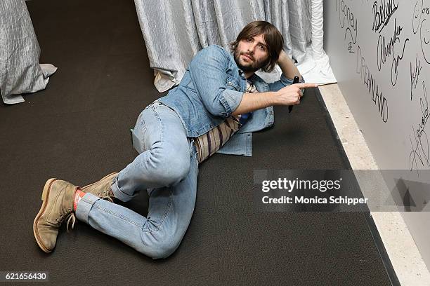 Actor and musician Robert Schwartzman signs the wall at AOL HQ when he visits for The Build Series Presents Robert Schwartzman Discussing The New...