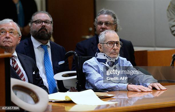 Lawyers Dick DeGuerin , Chip Lewis and David Chesnoff are seated with New York real estate heir Robert Durst at the Airport Branch of the Los Angeles...