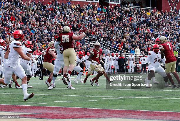 Boston College defensive tackle Ray Smith is helpless as the pass form Louisville Cardinals quarterback Lamar Jackson finds Louisville Cardinals...