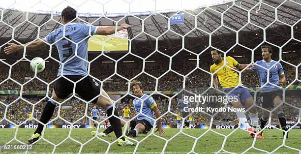 Brazil - Brazilian striker Fred scores the opening goal in the 41st minute of a Confederations Cup semifinal against Uruguay in Belo Horizonte,...