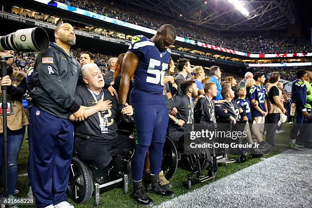 Defensive end Cliff Avril of the Seattle Seahawks is seen during opening ceremonies before a game against the Buffalo Bills at CenturyLink Field on...