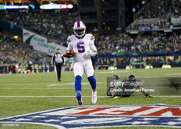 Quarterback Tyrod Taylor of the Buffalo Bills takes it in for a touchdown against linebacker Brock Coyle of the Seattle Seahawks at CenturyLink Field...