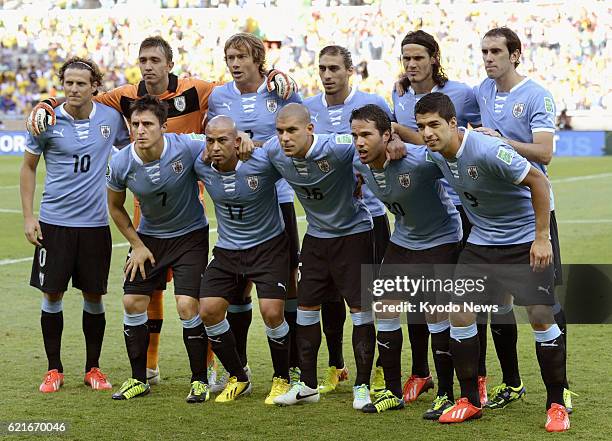 Brazil - Uruguay players pose for a team shot before a Confederations Cup semifinal with Brazil in Belo Horizonte, Brazil, on June 26, 2013. Brazil...