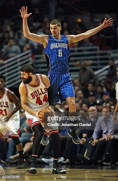 Mario Hezonja of the Orlando Magic leaps to try and block Nikola Mirotic of the Chicago Bulls at the United Center on November 7, 2016 in Chicago,...