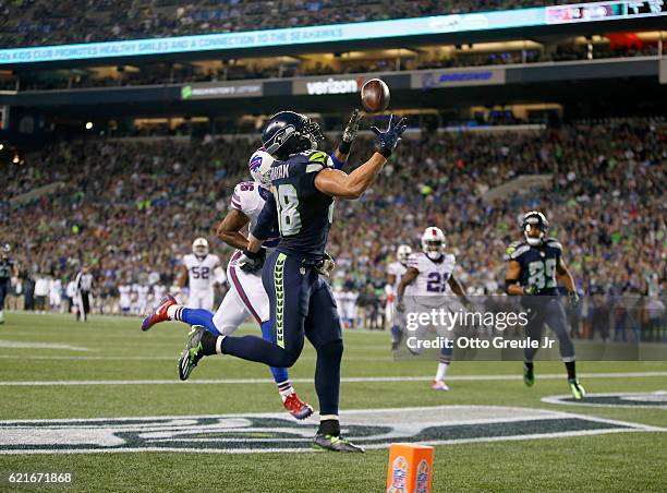 Tight end Jimmy Graham of the Seattle Seahawks makes a touchdown reception against safety Robert Blanton of the Buffalo Bills at CenturyLink Field on...