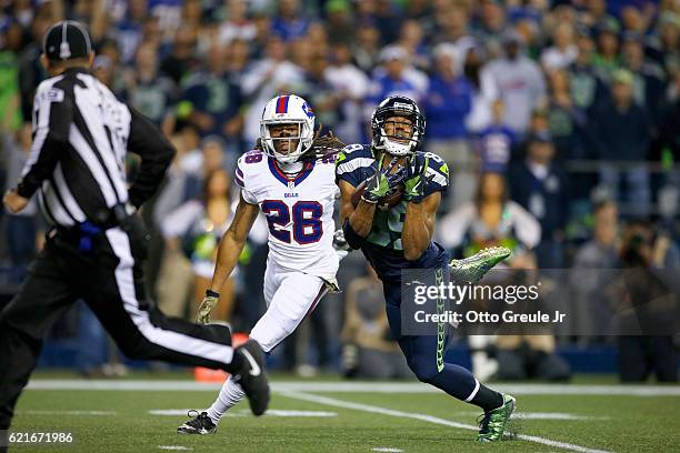 Wide receiver Doug Baldwin of the Seattle Seahawks pulls in a long reception against cornerback Ronald Darby of the Buffalo Bills at CenturyLink...