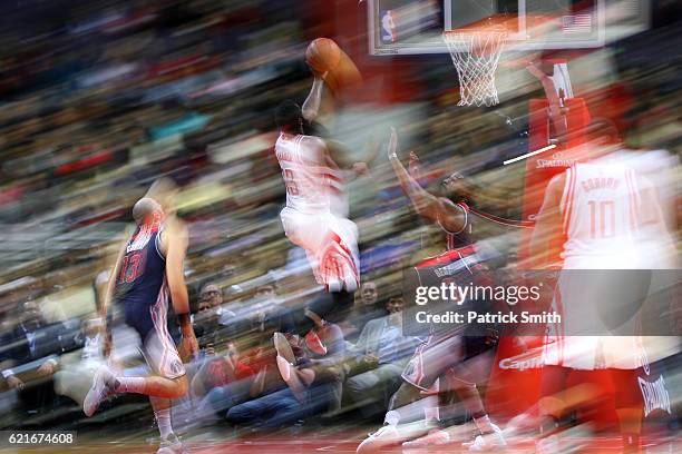 James Harden of the Houston Rockets shoots in front of Bradley Beal of the Washington Wizards during the second half at Verizon Center on November 7,...