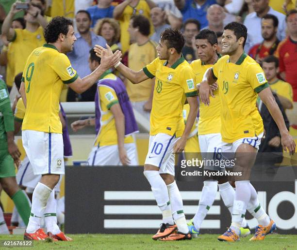 Brazil - Brazil's Neymar touches hands with his teammate Fred after scoring the team's second goal just before halftime in the Confederations Cup...