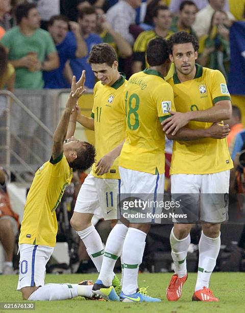 Brazil - Brazil's Neymar celebrates after scoring the team's second goal just before halftime in the Confederations Cup final against Spain in Rio de...