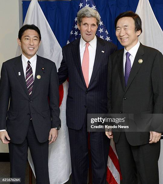 Brunei - Japanese Foreign Minister Fumio Kishida, U.S. Secretary of State John Kerry and South Korean Foreign Minister Yun Byung Se pose for photos...