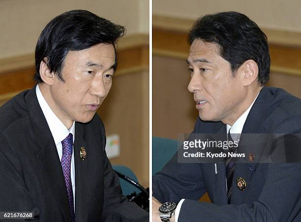 Brunei - Combination photo shows Japanese Foreign Minister Fumio Kishida and his South Korean counterpart Yun Byung Se while holding talks in Bandar...