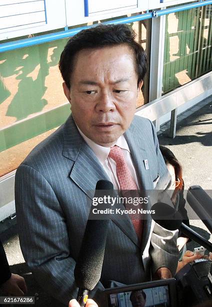 Switzerland - Tokyo Gov. Naoki Inose speaks with reporters after arriving at Geneva international airport on July 1, 2013. Inose is scheduled to...