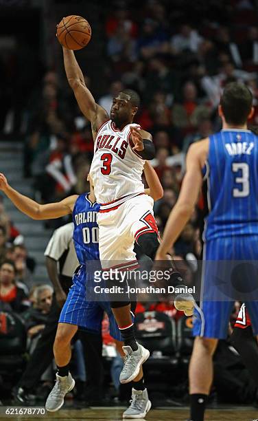 Dwyane Wade of the Chicago Bulls leaps to intercept a pass from Damjan Rudez of the Orlando Magic intended for Aaron Gordon at the United Center on...