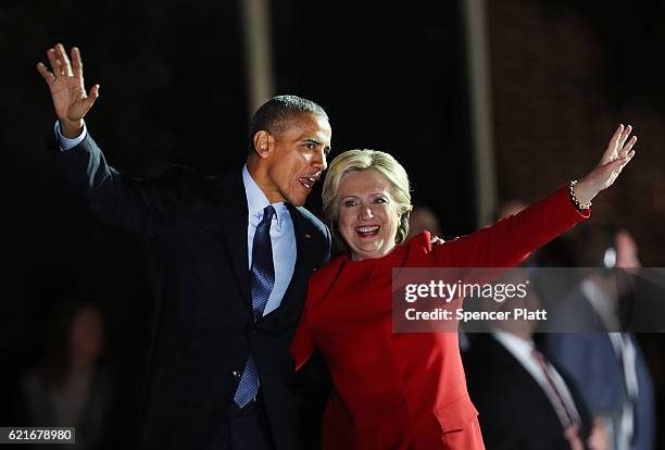 Democratic presidential nominee former Secretary of State Hillary Clinton stands with President Barack Obama during an election eve rally on November...