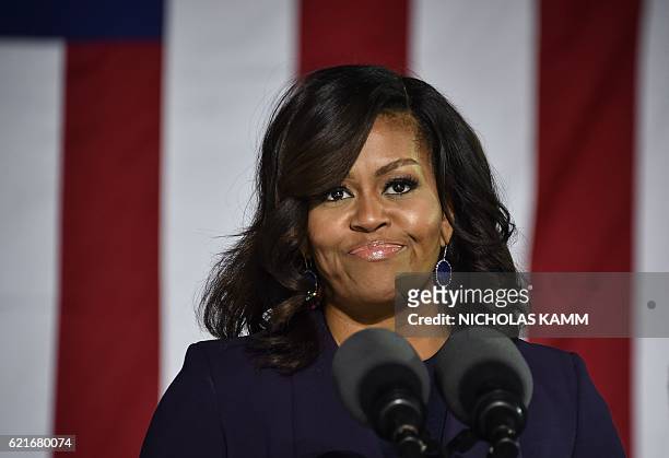 First Lady Michelle Obama speaks at a rally for Democratic presidential candidate Hillary Clinton in Durham, New Hampshire, on November 7, 2016. /...