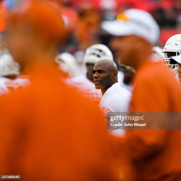 Head coach Charlie Strong of the Texas Longhorns watches his team warmup before the game against the Texas Tech Red Raiders on November 5, 2016 at...