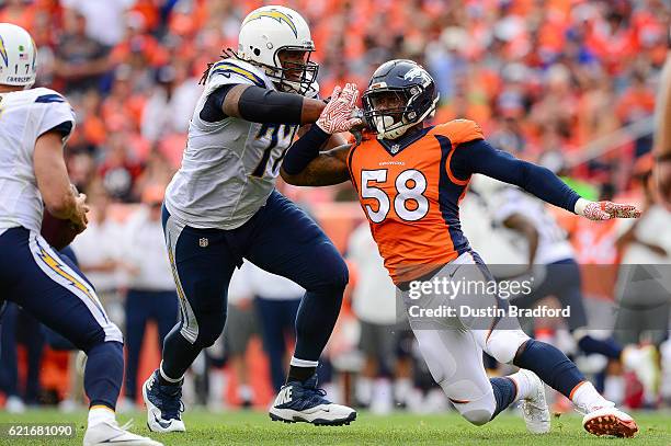 Outside linebacker Von Miller of the Denver Broncos rushes the passes as tackle King Dunlap of the San Diego Chargers blocks in the second quarter at...