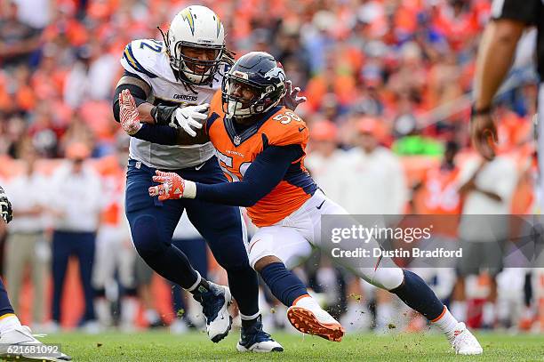 Outside linebacker Von Miller of the Denver Broncos rushes the passes as tackle King Dunlap of the San Diego Chargers blocks in the second quarter at...