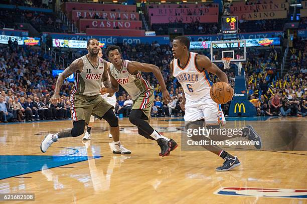 Oklahoma City Thunder Guard Semaj Christon makes a move towards the basket while Miami Heat Guard Josh Richardson and Miami Heat Forward James...