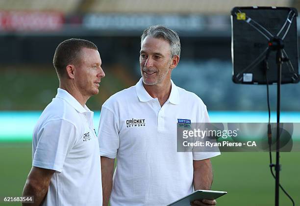 Former Australian Cricketers Chris Rogers and Damien Fleming, present for The Cricket Network and Optus Sport during day three of the First Test...