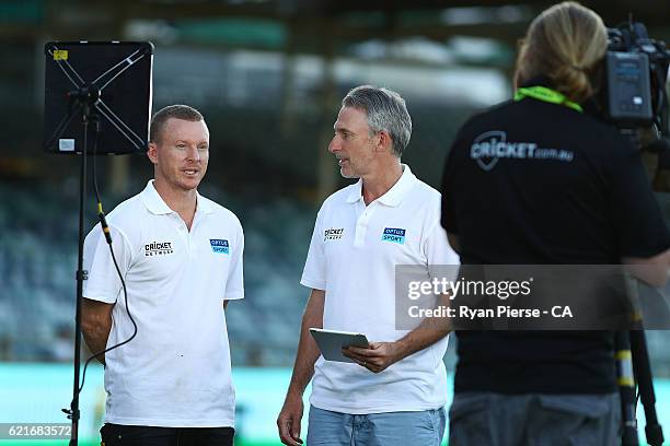 Former Australian Cricketers Chris Rogers and Damien Fleming, present for The Cricket Network and Optus Sport during day three of the First Test...