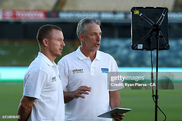 Former Australian Cricketers Chris Rogers and Damien Fleming, present for The Cricket Network and Optus Sport during day three of the First Test...