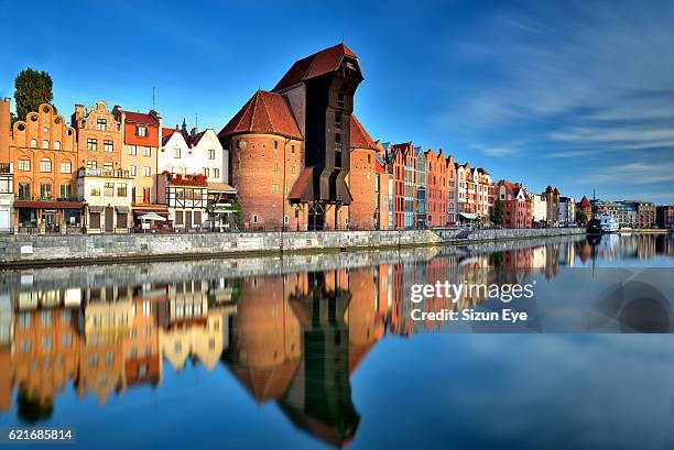 gdansk old town with reflection in the motlawa river, poland. - gdansk poland stock pictures, royalty-free photos & images