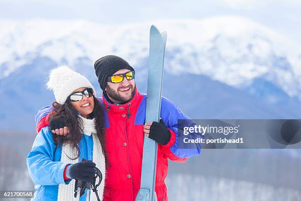 couple skiers standing on top of the snow mountain - friends skiing stock pictures, royalty-free photos & images