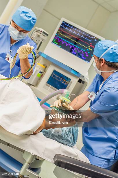 er team helping a wounded young woman - lung ventilator stock pictures, royalty-free photos & images