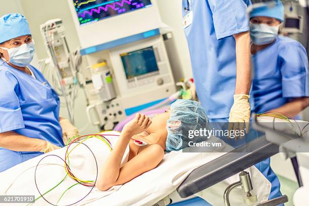 young boy lying in operating room - pediatric intensive care unit stock pictures, royalty-free photos & images