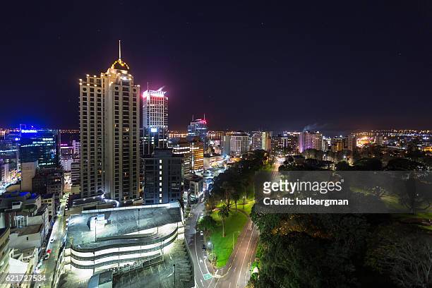 albert park and auckland buildings at night - melbourne parkland stock pictures, royalty-free photos & images