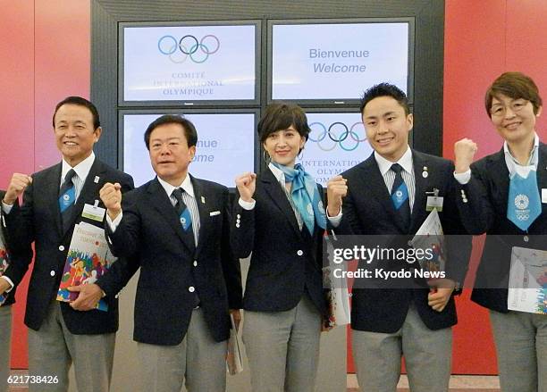 Switzerland - Japanese Deputy Prime Minister and Finance Minister Taro Aso, Tokyo Gov. Naoki Inose, newscaster Christel Takigawa, Olympic silver...
