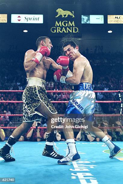 Prince Nassem Hamed gets a left cross in the face during the fight against Marco Antonio Barrera at the MGM Grand Hotel/Casino in Las Vegas, Nevada....