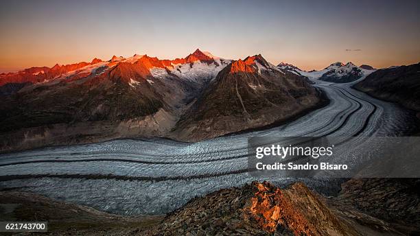 aletsch glacier warm sunrise - aletsch glacier stock pictures, royalty-free photos & images