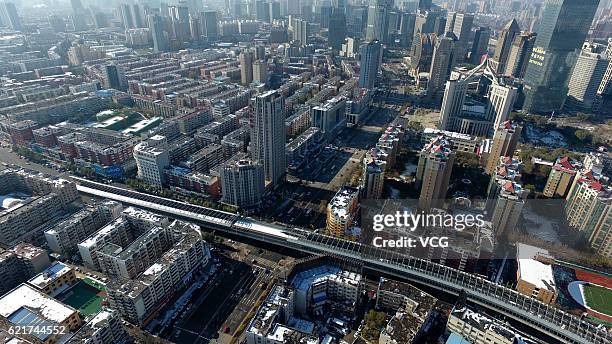 Aerial view of high-speed highway running across from the north to the south with noise barrier walls on November 8, 2016 in Shenyang, Liaoning...