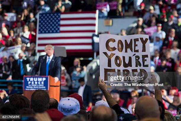 Supporters holds up a "Comey You're Fired" sign as Republican presidential candidate Donald Trump speaks during a campaign event at J.S. Dorton Arena...